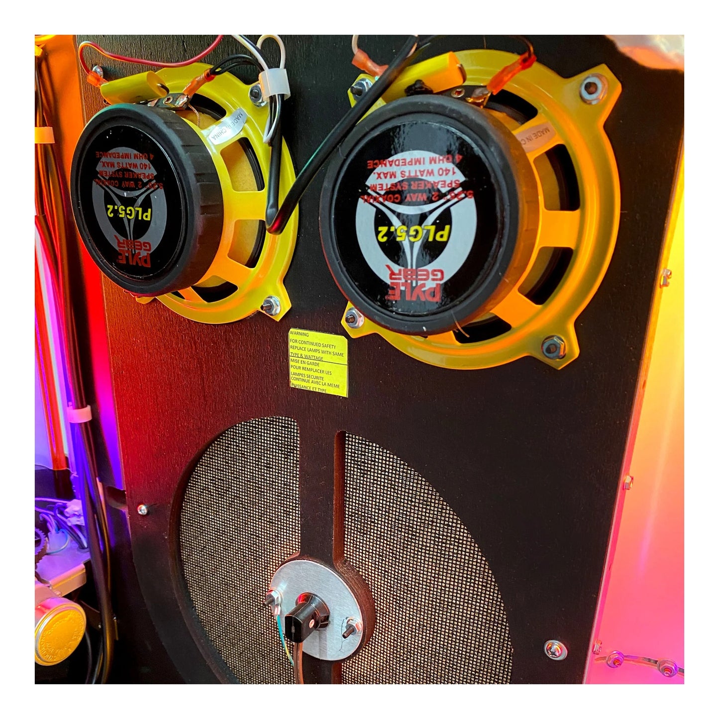 Speaker with visible brand name and model number on a colorful background