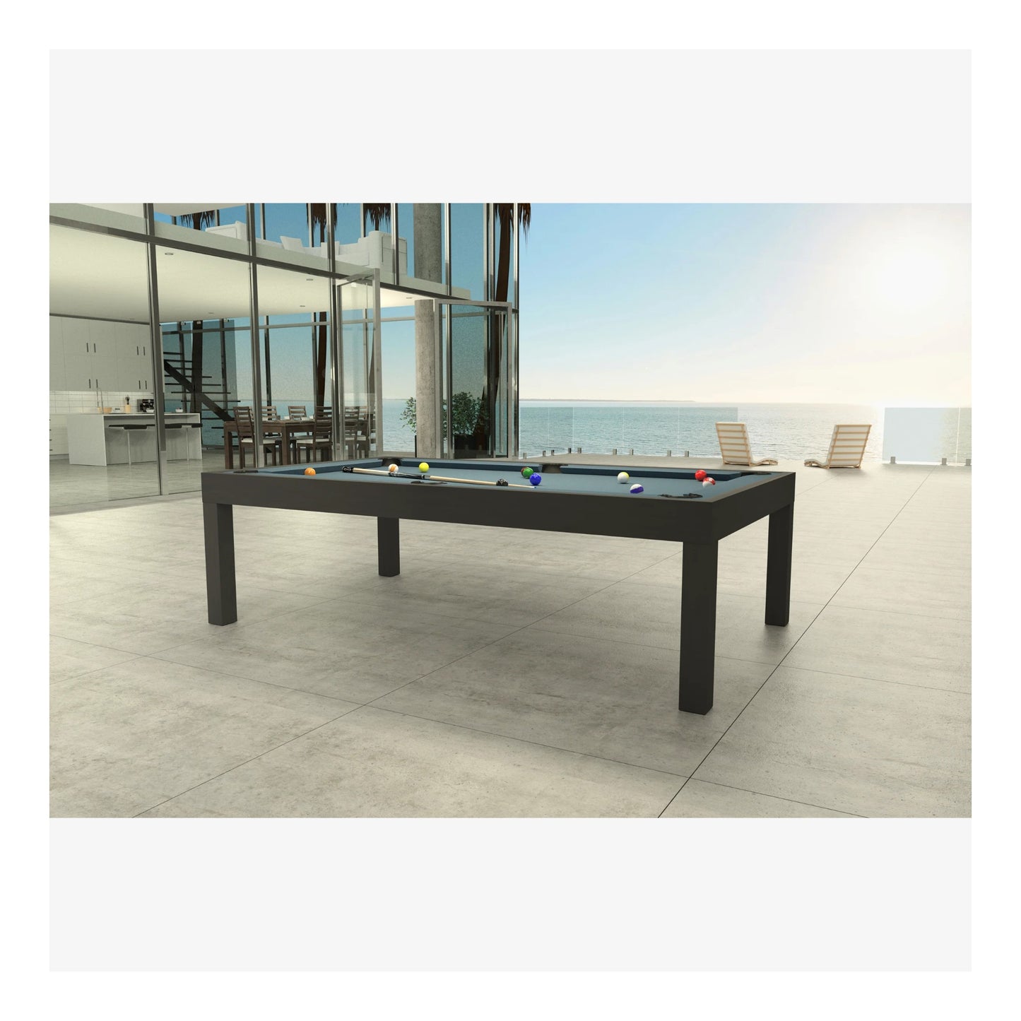 Outdoor pool table on a patio with ocean view