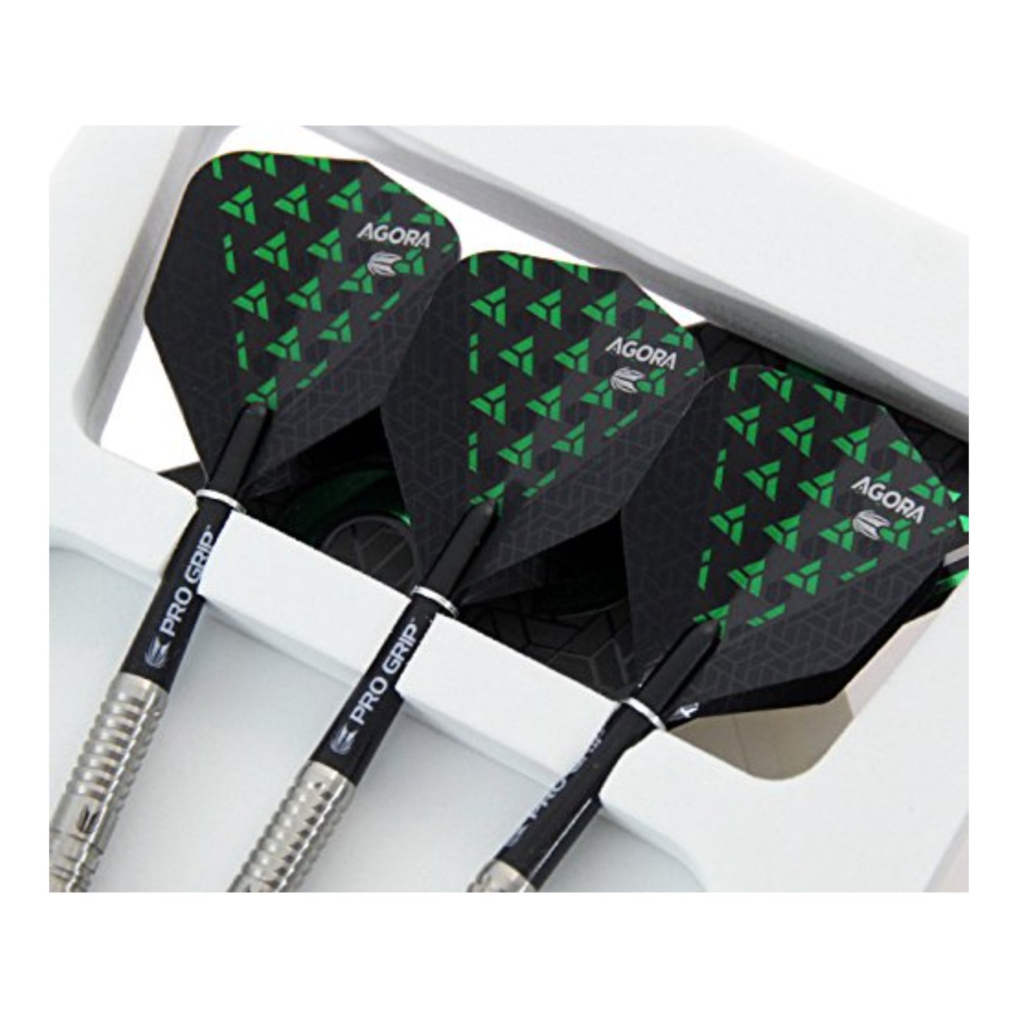 Three Target Agora 90% tungsten dart barrels laid out to show radial grooves and vertical milling cuts.