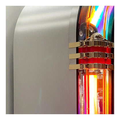 Close-up of a colorful object with metallic elements on a white background