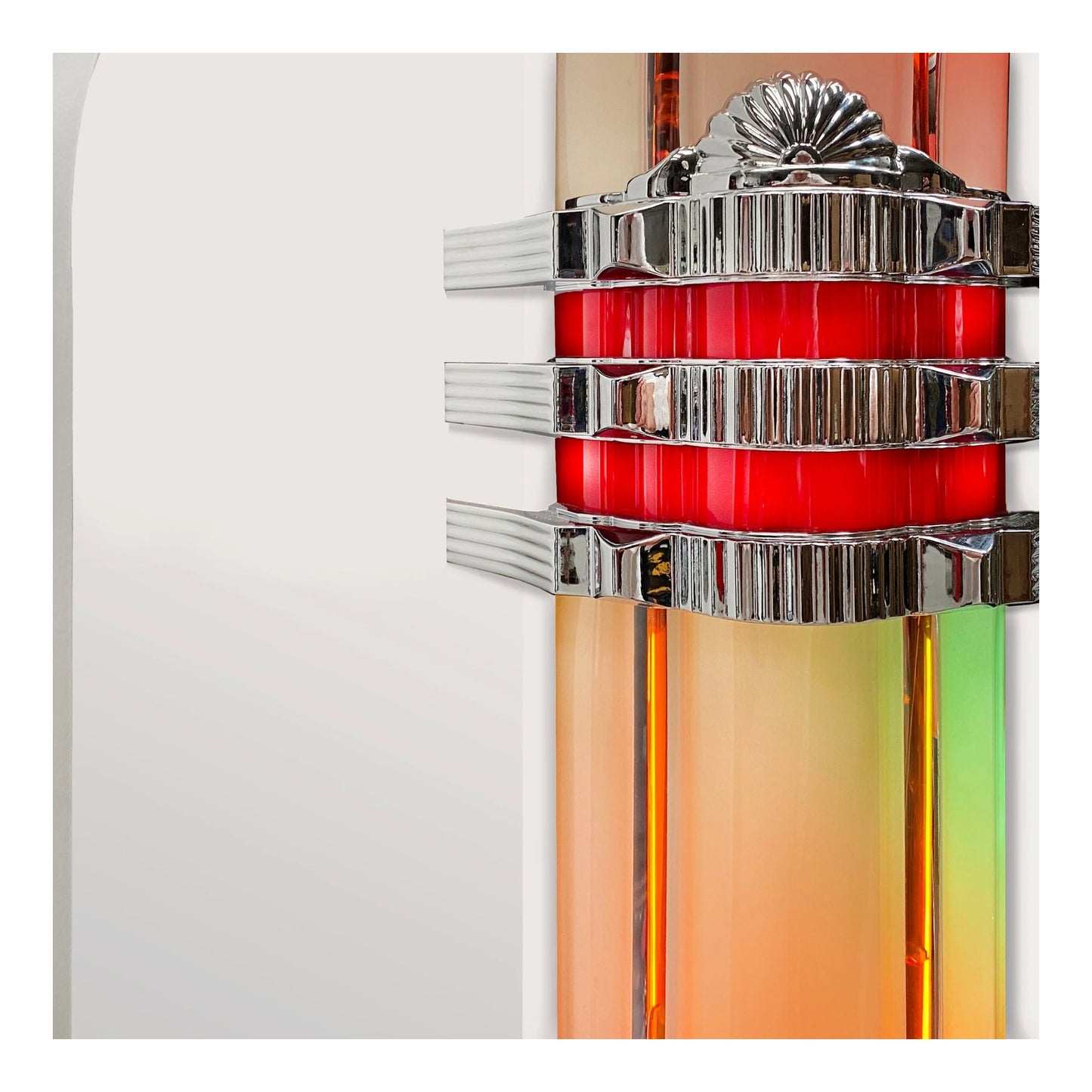 Decorative wall sconce with red center and silver accents on a white background