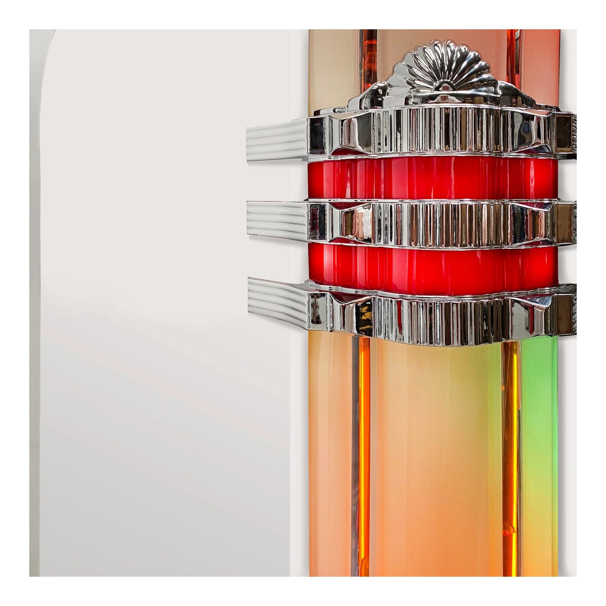 Decorative wall sconce with red center and silver accents on a white background