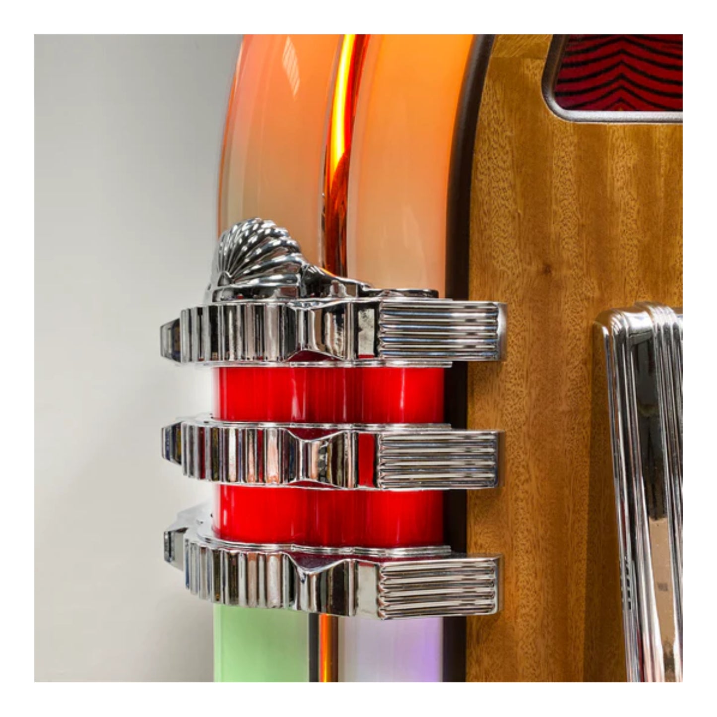 Close-up of a guitar with a red and silver pickguard