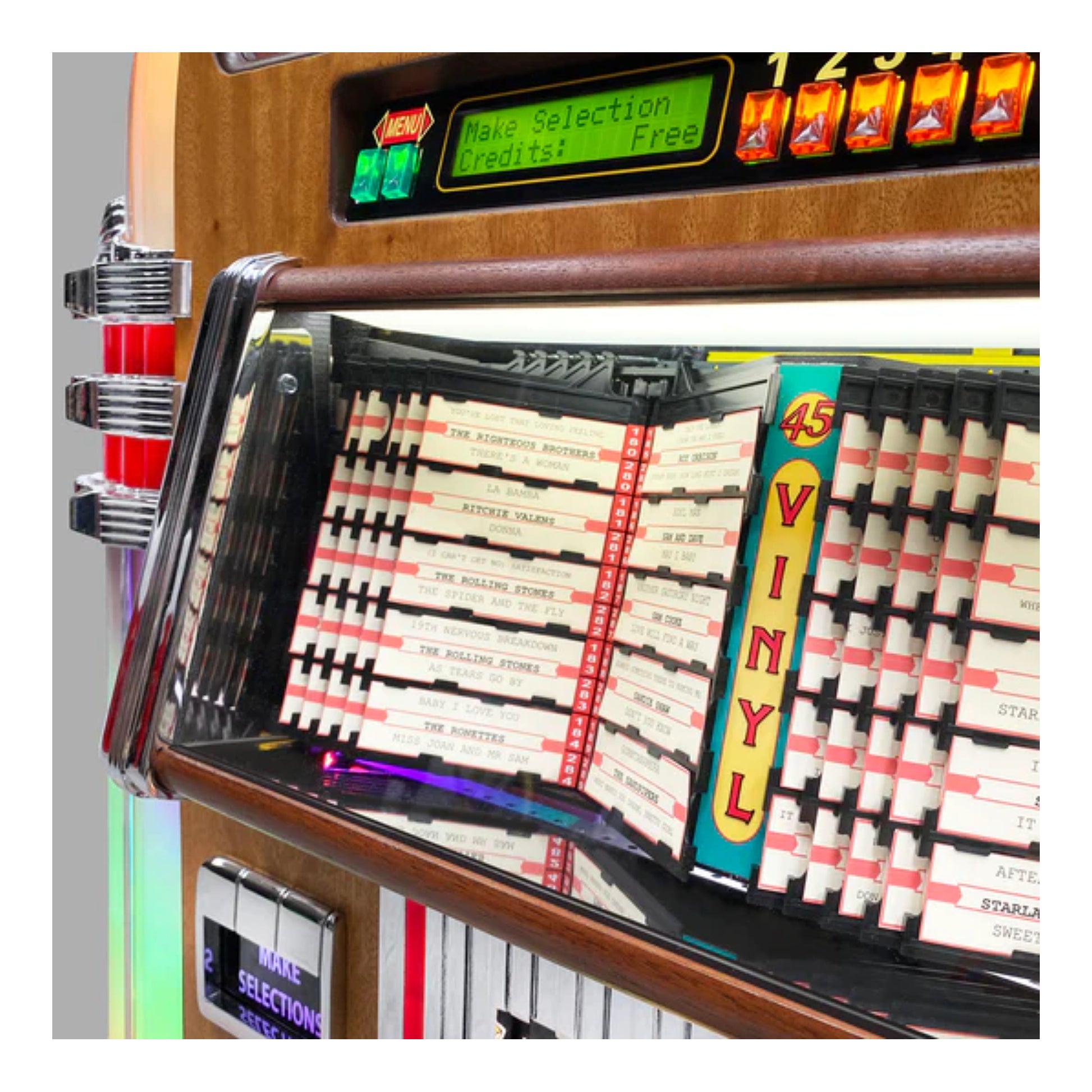 Close-up of a jukebox with vinyl records and a digital display.