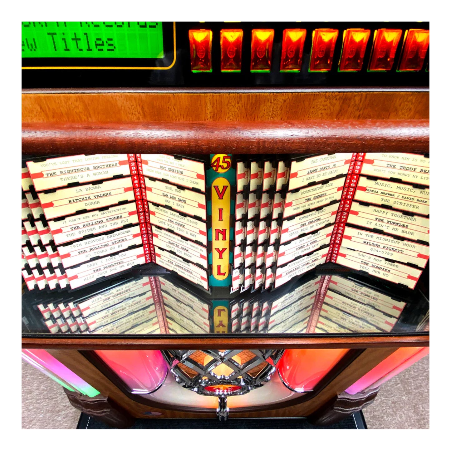 Vintage-style jukebox with vinyl record slots and colorful display.
