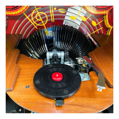 Vintage record player with a vinyl record on a wooden surface
