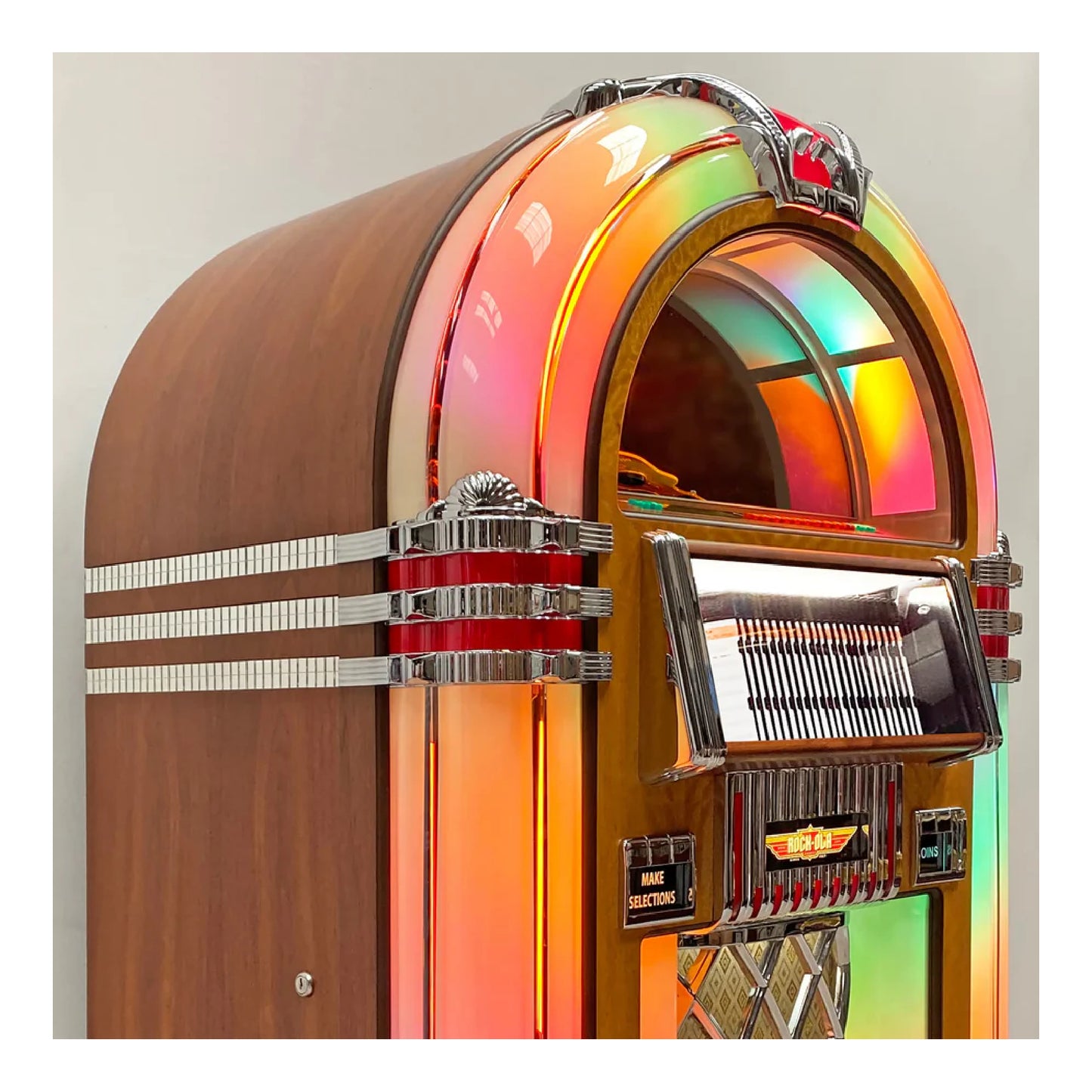 Vintage-style jukebox with a rainbow-colored top on a plain background