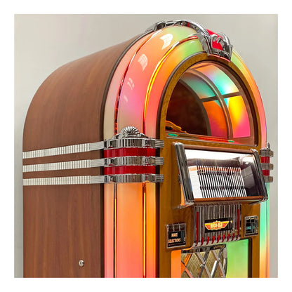 Vintage-style jukebox with a rainbow-colored top on a plain background