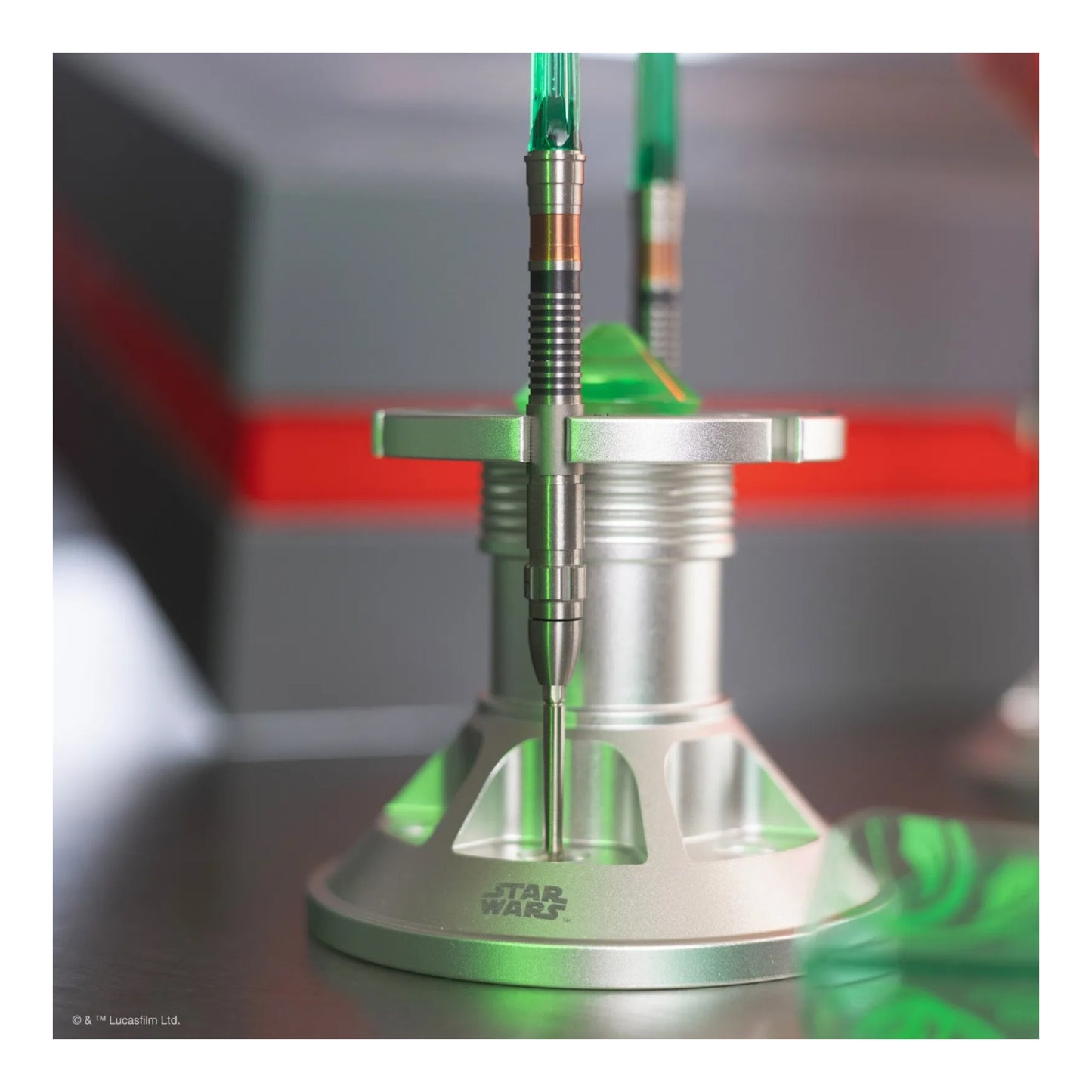 The premium Luke Skywalker Lightsaber Display Stand, empty, showing its detailed silver design.