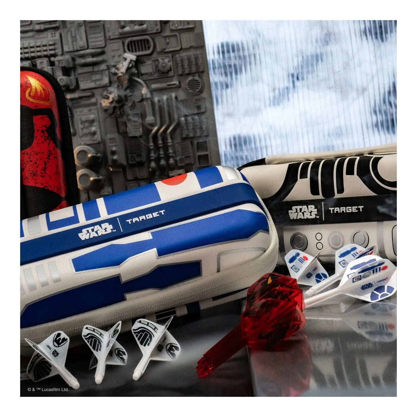 Star Wars-themed dart set with R2-D2 design on a reflective surface.