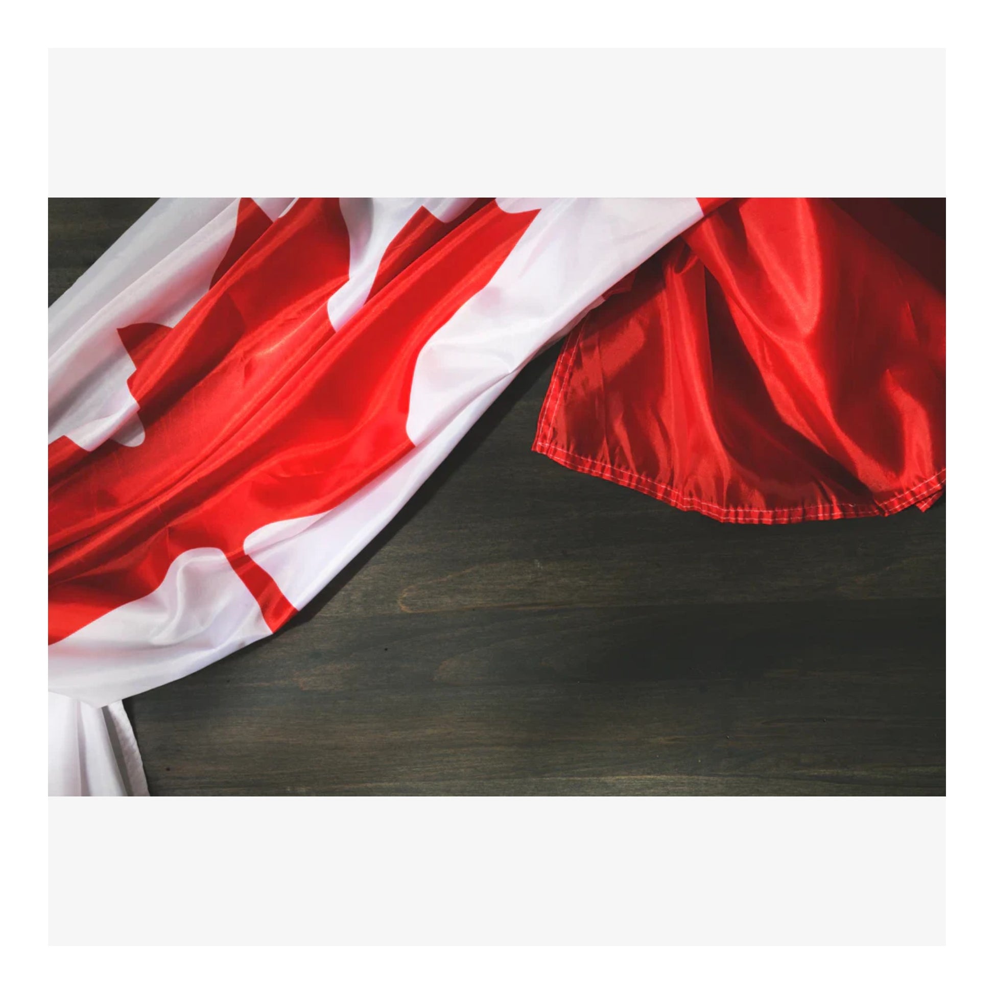 Red and white fabric on a dark wooden surface